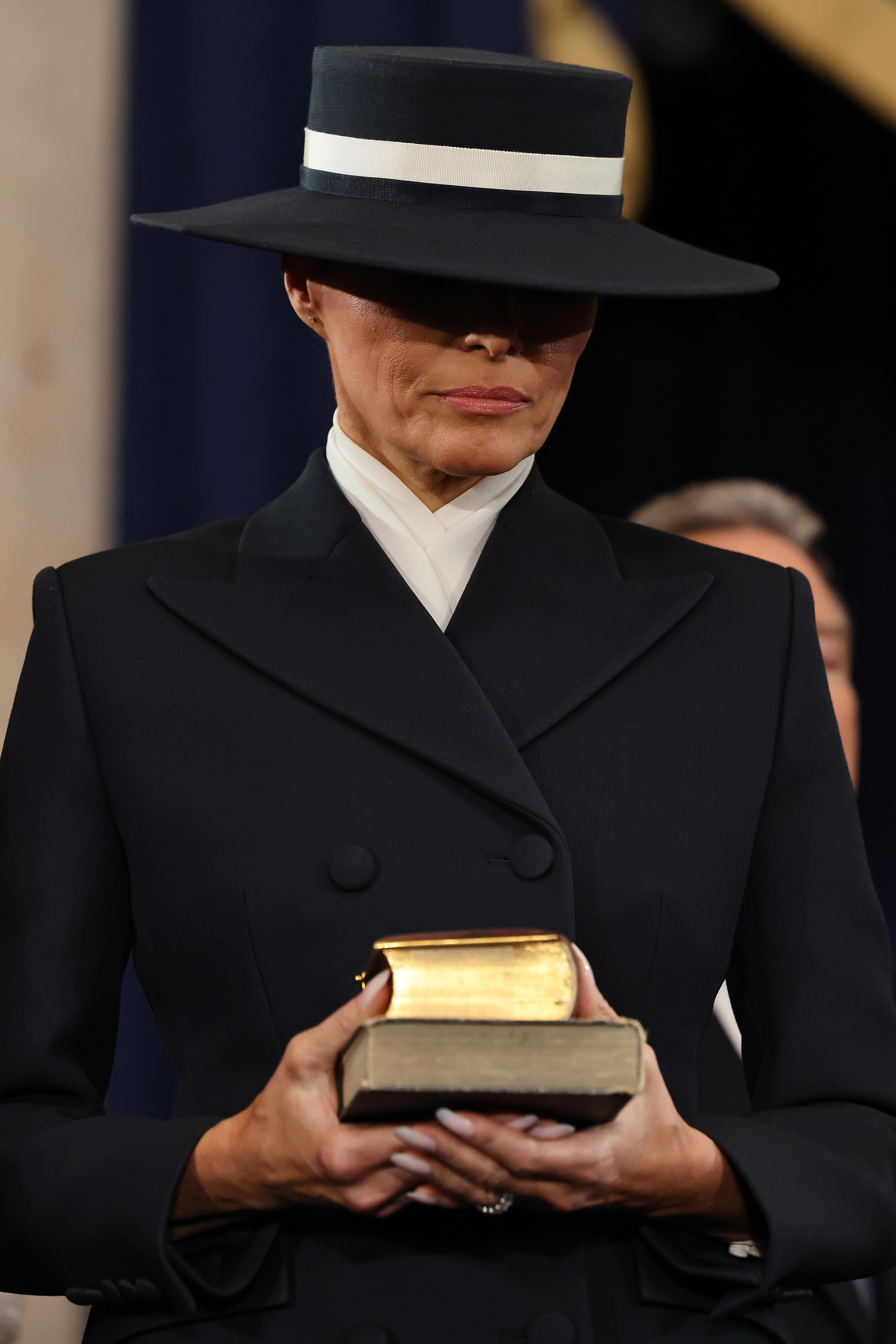896071077a15d9c7431f53b20ad724da627c741159f0517ae724d7bf6e438a70 Melania Trump holding two bibles during Donald Trump's second inauguration. | Source: Getty Images