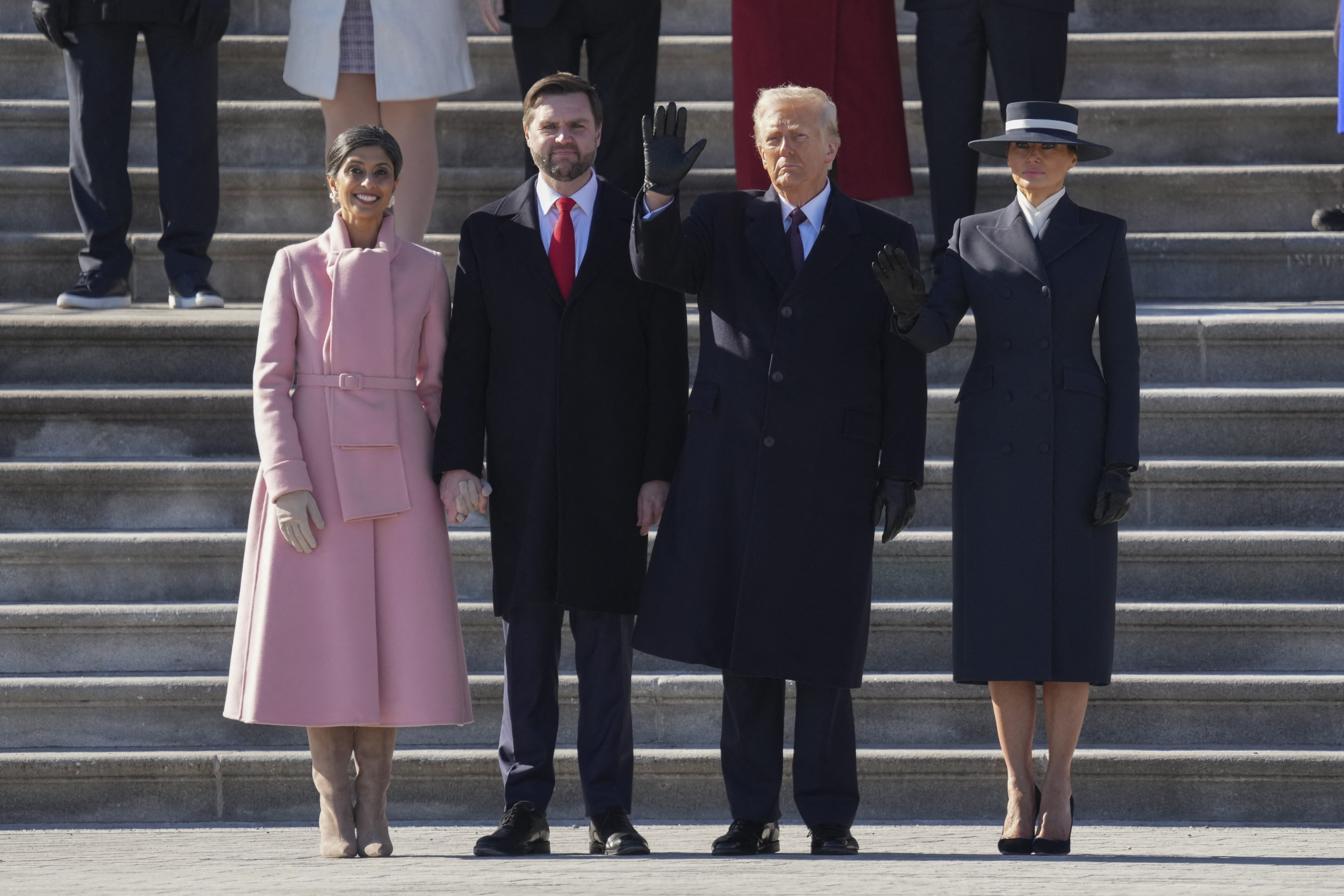 fdbcade144c4ca43af945bce04737455a26153796cc1b0baa25bb1c3a3437564 Second Lady Usha Vance, Vice President JD Vance, President Donald Trump and First Lady Melania Trump posing on the Capitol steps. | Source: Getty Images