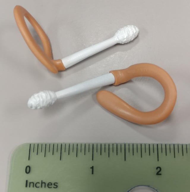r/whatisthisthing - Plastic strap on cotton swabs? Unidentified object received in a recent cookie order from Online Fundraising Shop. They are rubbery plastic. They don't seem related to any of the food items in my purchase (frozen cookie dough and soup mix). Emailed company, but haven't heard back. No markings.